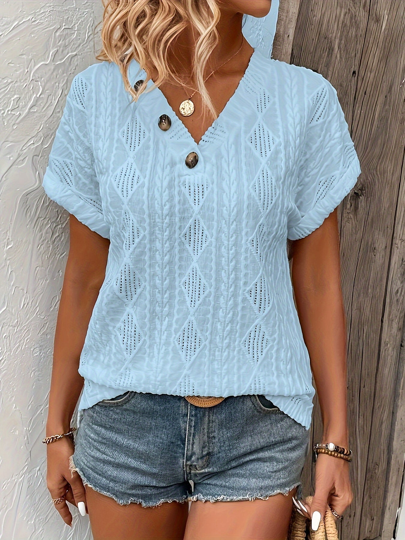 ANGELITA | Gebreide V-hals top met knoopdetail