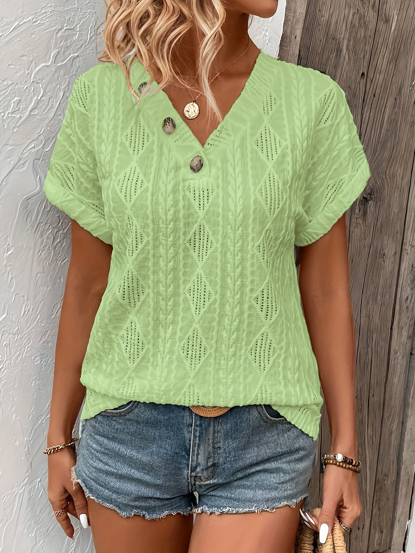 ANGELITA | Gebreide V-hals top met knoopdetail