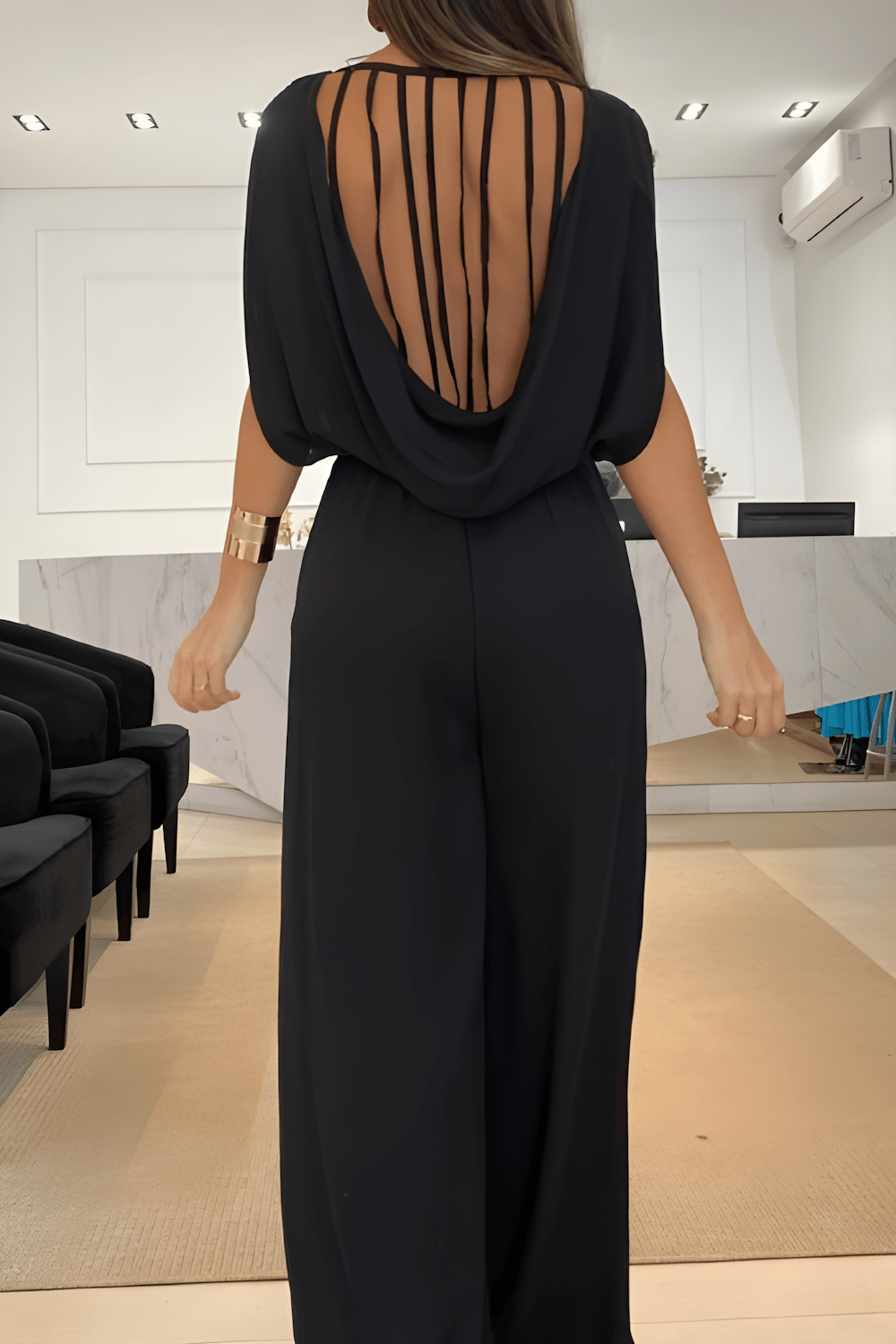 DELIA | Mouwloze jumpsuit met wijdvallende pijpen